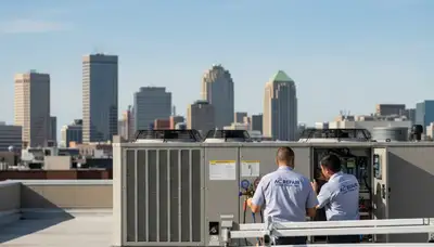 Professional AC repair technician servicing air conditioner in Minneapolis MN home