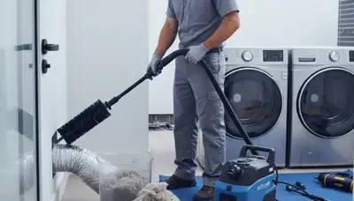 Technician performing professional dryer vent cleaning in Minneapolis MN for improved home safety